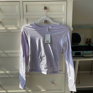 Violet long sleeve shirt. Size small. Fit runs small. Very soft.